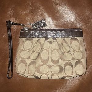 Brown Coach synched wristlet- never used
